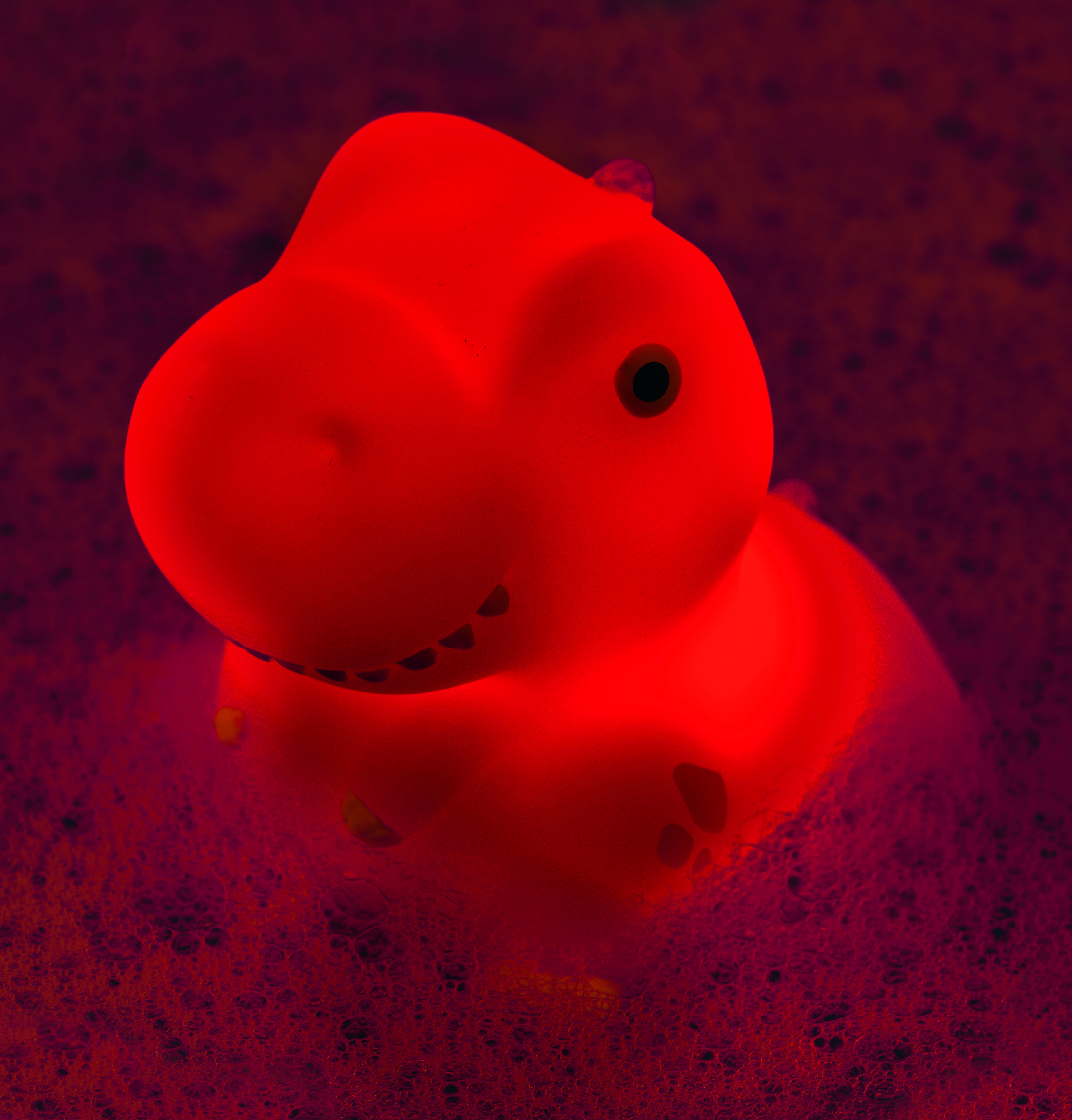 40247_rot_Anw Leuchtender Bade-Dino (einzeln)